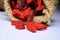 dried goji berry seeds in cloth sacks falling on a white background