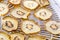 Dried golden kiwi fruit on a food dehydrator with shallow depth