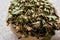 Dried Hawthorn / Crataegi folium flore in wooden ladle