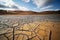 Dried land in the desert. Cracked soil crust