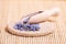 Dried lavender petals on the wooden spoon