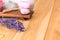 Dried lavender and soap with natural lavender extract for spa treatments and relaxation on wooden boards