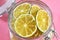 Dried lemons and limes in an electric dryer in a glass jar