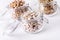 Dried Lentils Chickpeas White beans in Glass Jars on White Wooden Background Close Up