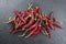 Dried Mexican red hot Chile Guajillo chili on black background