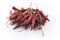 Dried Mexican red hot Chile Guajillo chili offered as close-up on white background - free-form select