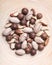 Dried mixed nuts in wooden bowl closeup