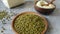 Dried mung beans on a plate and flour close up