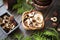 Dried mushrooms cep and boletus in wooden bowl on dark wooden background