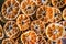 Dried orange slices on the wooden table. Dry citrus. Dried citrus fruits on the table. Orange slices top view. Tangerine or