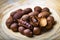 Dried organic exotic tamarind fruits in bamboo bowl