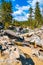 Dried out Yosemite waterfall with small river and pond where used to be mighty falls.