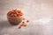 Dried physalis in wooden bowl on wood textured background. Copy space. Superfood, vegan, vegetarian food concept. Macro of inca