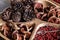 Dried pinecone with bale fruit on wooden tray, selective focus, shallow depth of field