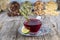 Dried rose hip cup of herbal tea medicinal plants on wooden vintage table and rosehips.Rosehip tea