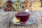 Dried rose hip cup of herbal tea medicinal plants on wooden vintage table and rosehips.Rosehip tea