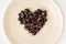 Dried rose hips in heart shape on the plate, Valentine\'s day