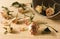 Dried rosebuds scattered from wooden bowl