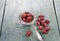 Dried rosehips ,tea strainer,on wooden background.