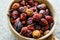 Dried Rosehips in wooden ladle / kusburnu