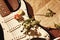 Dried roses on electric guitar and old sheet music closeup