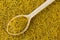 Dried Sacred Indian Lotus yellow stamen flower in wooden spoon t