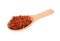 Dried safflower in wooden spoon and on white background