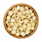 Dried shelled white lotus nuts, water lily seeds in wooden bowl