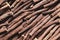 Dried sticks of liquorice root as background, top view