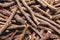 Dried sticks of liquorice root as background, top view