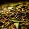 Dried tea leaves macro closeup. Dried green tea leaves on a wooden table. Selective focus. Shallow dof. preparation of black tea