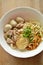 Dried thin rice noodle with pork ball and boiled meat on bowl