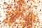 Dried tomato flakes as background, top view. Chopped tomatoes