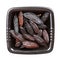 Dried tonka beans in black bowl isolated