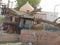 A dried tree near temple uprooted during storm in India