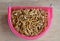 Dried worm for feeding rodent and bird with lizard on pet bowl