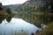 Drift boat moored at the edge of a tranquil river