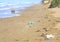 Drifted plastic waste on a beach in the mediterranean pollution of the ocean with microplastics,environment protection