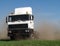 Drifting truck makes huge dust cloud