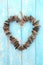 Driftwood Heart Shaped Wreath Sculpture on Rustic Blue Wood