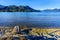 Driftwood on the shores of Pitt Lake with the Snow Capped Peaks of the Golden Ears Mountains