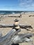 Driftwood Waves Pebbles Stones beach Rocks clear fresh Lake sea water bridge blue wet