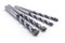 Drill bits made from Titanium isolated over white background. Drill bits of different sizes.set of working tools