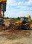 Drilling machinery and backhoe