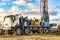 The drilling rig close up. Powerful drilling rig against a cloudy sky. Deep hole drilling. Geological exploration work. Mineral