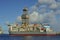 Drilling ship moored in port with a cloudy day