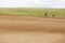 Drilling a water well for irrigation in an Idaho farm field