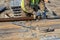 Drilling worker tightens drill pipe