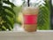 Drink Beverage, iced coffee Cappuccino Smoothie in clear plastic glass put on white steel blurred of nature background, space red