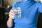 Drink plenty of water from the virus, Covid-19 Pandemic Coronavirus. Girl drinks water from a glass